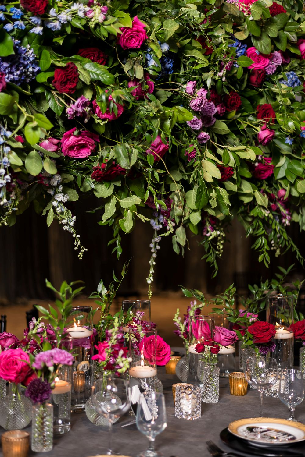 Luxury wedding ceremony setup with candles, bohemian floral arrangements, and elegant décor reflecting a personalized celebration.